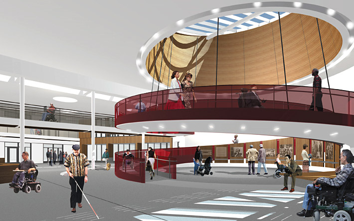 Interior view of the Ed Roberts Campus in Berkeley with a central spiral ramp and disabled people exploring the space.